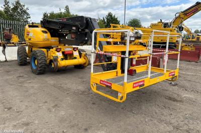 image showing a large yellow on-track machine