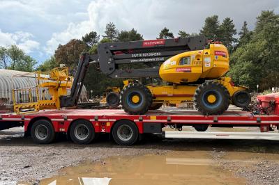 image showing a large yellow on-track machine