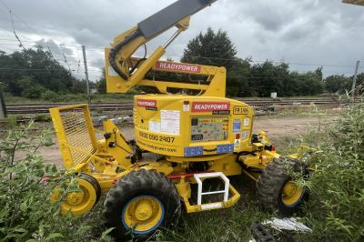 image showing a large yellow on-track machine