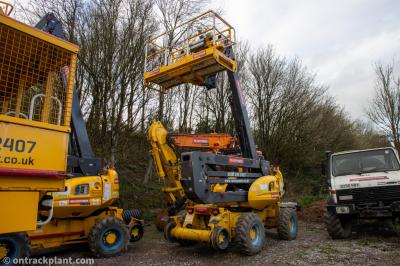 image showing a large yellow on-track machine