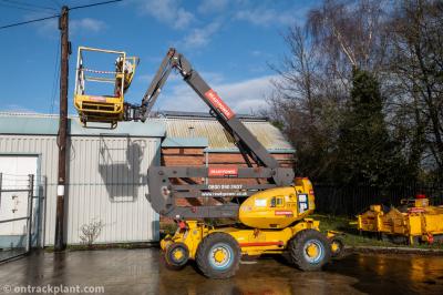 image showing a large yellow on-track machine