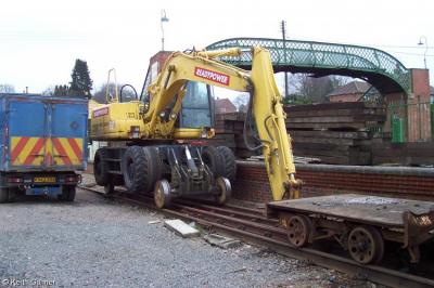 image showing a large yellow on-track machine