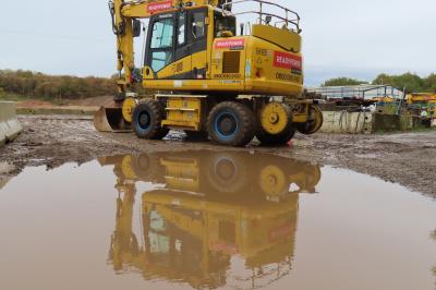 image showing a large yellow on-track machine