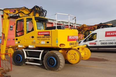 image showing a large yellow on-track machine
