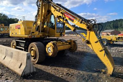 image showing a large yellow on-track machine