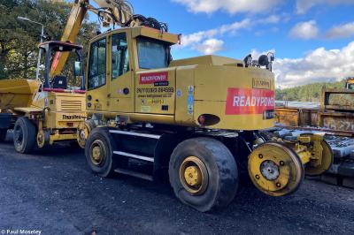 image showing a large yellow on-track machine