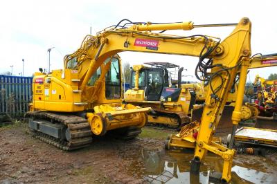 image showing a large yellow on-track machine