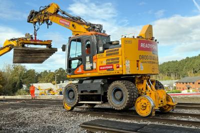 image showing a large yellow on-track machine