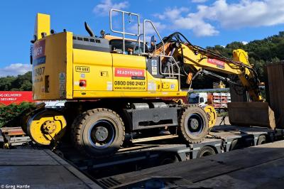 image showing a large yellow on-track machine