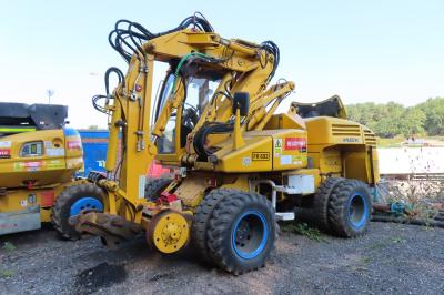 image showing a large yellow on-track machine