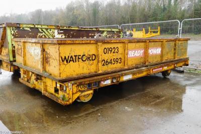 image showing a large yellow on-track machine