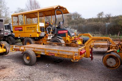 image showing a large yellow on-track machine