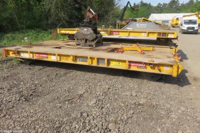 image showing a large yellow on-track machine