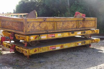 image showing a large yellow on-track machine