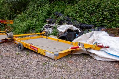 image showing a large yellow on-track machine