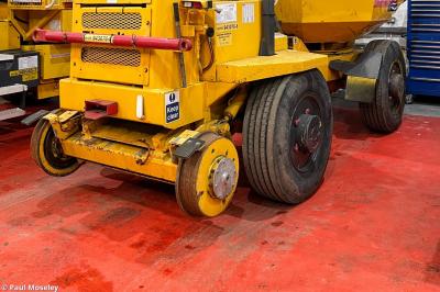 image showing a large yellow on-track machine