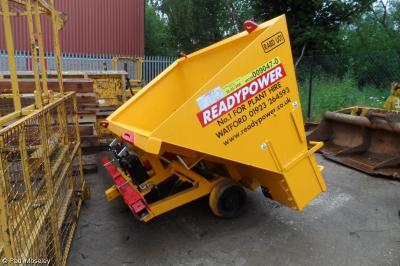 image showing a large yellow on-track machine