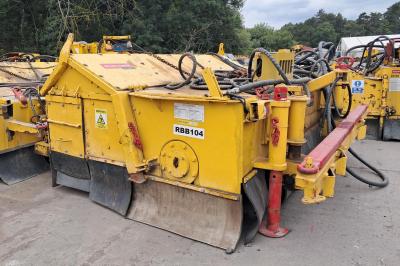 image showing a large yellow on-track machine