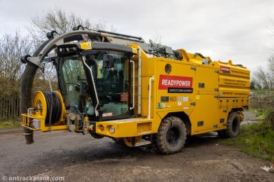 image showing a large yellow on-track machine