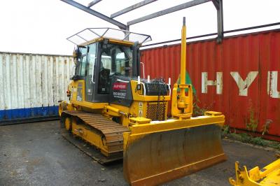 image showing a large yellow on-track machine