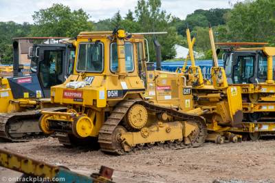 image showing a large yellow on-track machine