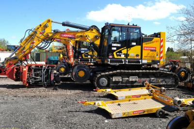 image showing a large yellow on-track machine