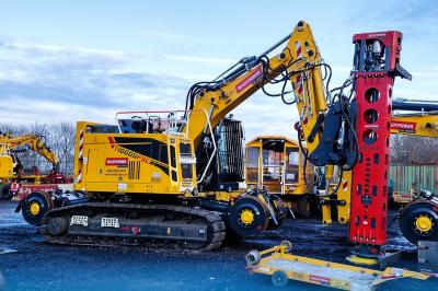 image showing a large yellow on-track machine