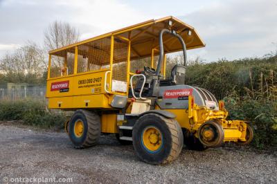 image showing a large yellow on-track machine