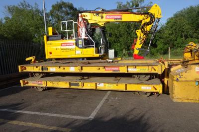 image showing a large yellow on-track machine