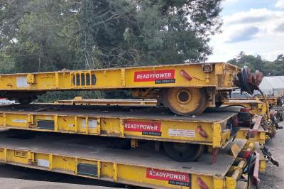 image showing a large yellow on-track machine