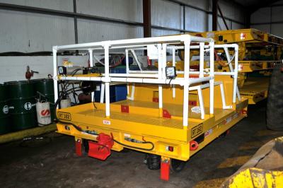 image showing a large yellow on-track machine