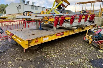 image showing a large yellow on-track machine