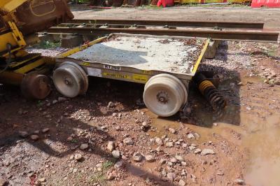 image showing a large yellow on-track machine