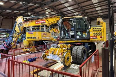 image showing a large yellow on-track machine