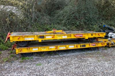 image showing a large yellow on-track machine
