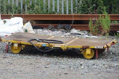 image showing a large yellow on-track machine
