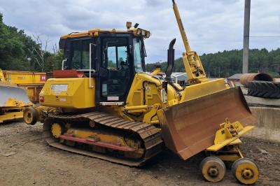 image showing a large yellow on-track machine