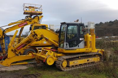 image showing a large yellow on-track machine