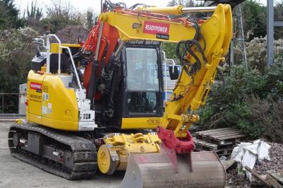 image showing a large yellow on-track machine
