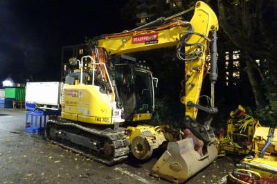 image showing a large yellow on-track machine