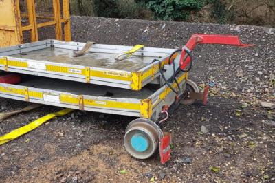 image showing a large yellow on-track machine