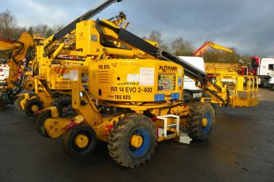 image showing a large yellow on-track machine