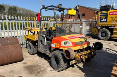 image showing a large yellow on-track machine