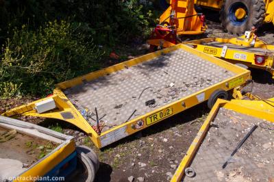 image showing a large yellow on-track machine