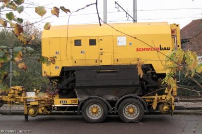 image showing a large yellow on-track machine