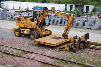 image showing a large yellow on-track machine