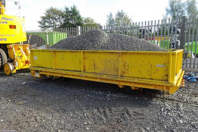 image showing a large yellow on-track machine