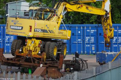 image showing a large yellow on-track machine