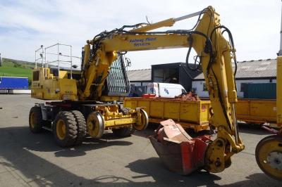 image showing a large yellow on-track machine