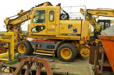 image showing a large yellow on-track machine